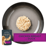 Isolated aerial image of a plate of Encore chicken with duck dog food jelly
