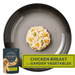 Isolated aerial image of a plate of Encore chicken with garden vegetables dog food jelly