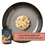 Isolated aerial image of a plate of Encore chicken with ham dog food jelly