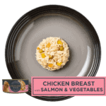 Isolated aerial image of Encore chicken in broth dog food with salmon & vegetables on a plate