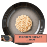 Isolated aerial image of a plate of Encore cat food chicken and ham