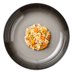 Isolated aerial image of a plate of Encore chicken in broth dog food with vegetables