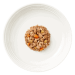 Isolated aerial image of Encore beef steak & vegetables dog food in gravy on a plate