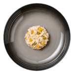 Isolated aerial image of Encore chicken with ham dog food jelly on a plate