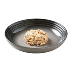 Isolated image of a plate of Encore chicken and brown rice cat food