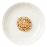 Isolated aerial image of a plate of mackerel cat food with tuna and seabream