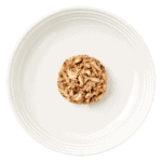 Isolated aerial image of a plate of encore tuna with salmon cat food